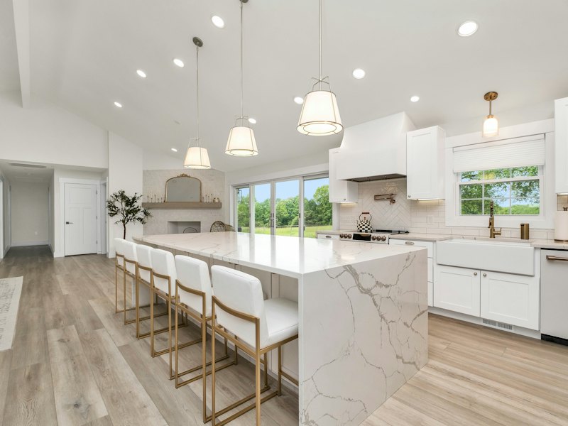 Remodeled kitchen with a marble island